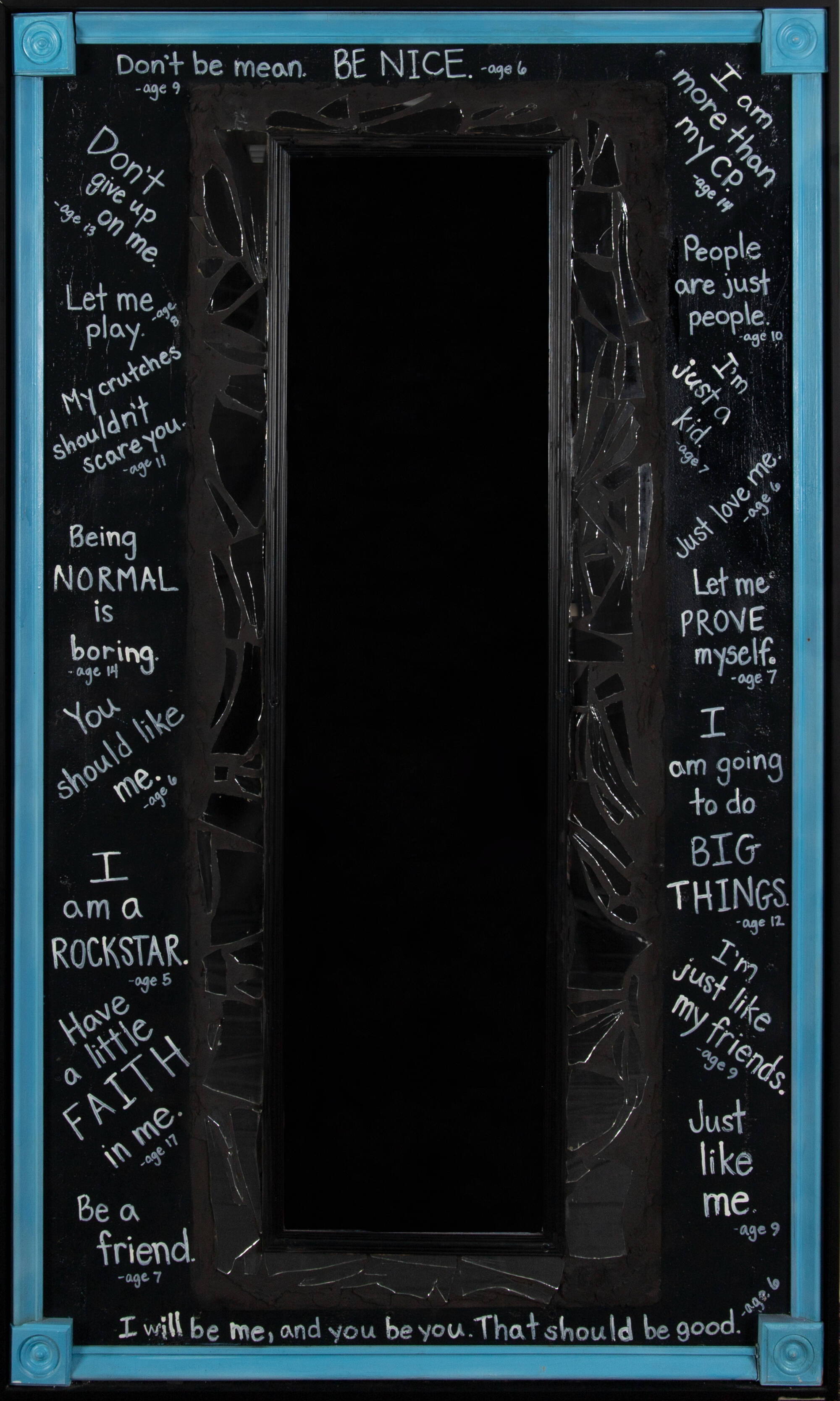 Mirror with positive statements, like "I'm going to do big things" written around the frame.
